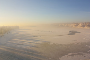 Frozen River in dawn sunlight.