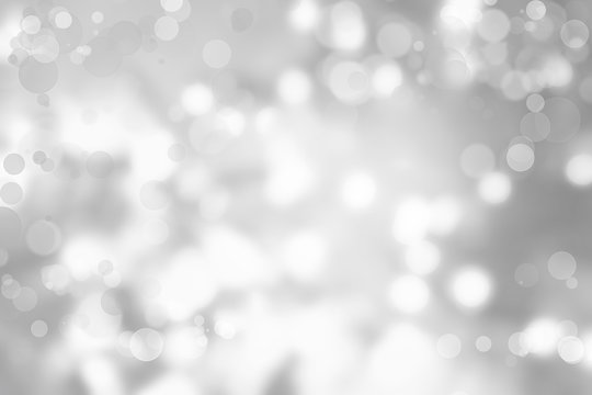 Abstract silver bokeh light blur background