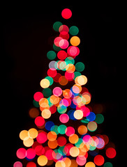 Christmas tree lights on black background