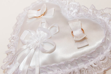wedding rings on a pillow