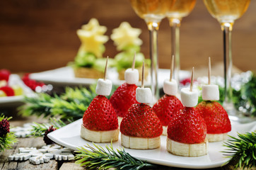 Assortment of New Year's snacks and a glass of champagne