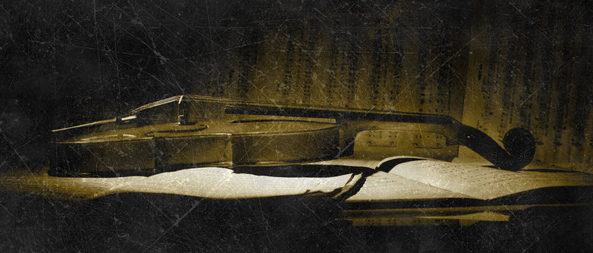 Vintage violin on the sheet music.
