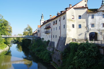 Fototapeta na wymiar Skofja Loka, Selska Sora river. On the right is the old town.