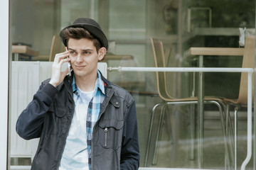 young with the telephone phone in the street of the city