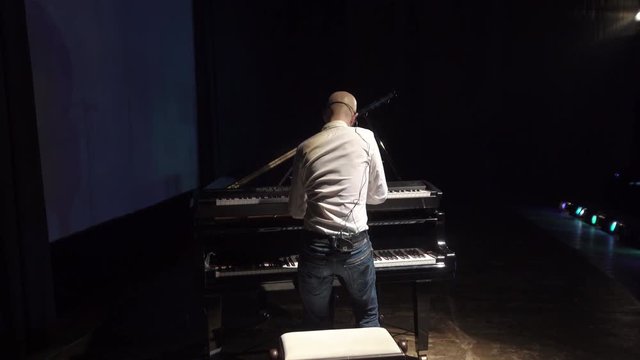 Man Playing Piano on Stage