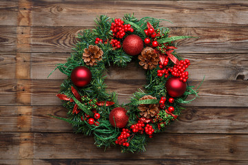 Christmas wreath on wooden background