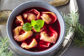 Traditional homemade red borscht dumplings Christmas table