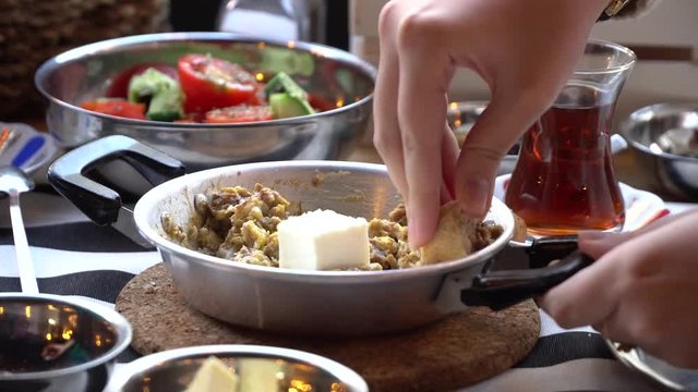 Omelet with mushrooms in a frying pan. Two young beautiful woman having breakfast in the morning at a restaurant in Istanbul Turkey