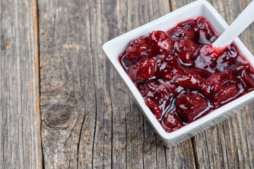 Cherry jam in a white bowl