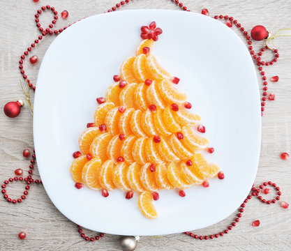 Tangerine Christmas tree - fun food idea for kids party, New Year food background