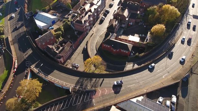 Descending aerial shot of a busy British road.