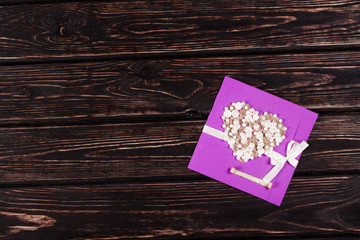 Violet greeting card on wood desk