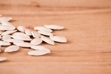 Pumpkin  seeds on wood desk