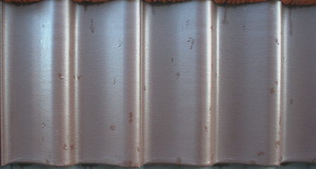 Brown enamel roof clay shingles with raindrops texture