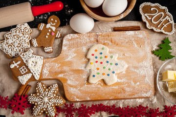 cooking christmas gingerbread on wooden background top view