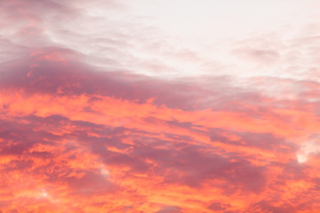 Colorful warm clouds on sky at sunset