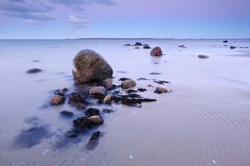 Coastal Sunset, Huge Boulders on Sand Beach,  Baltic Sea