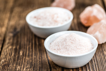 Wooden table with Pink Salt (selective focus)