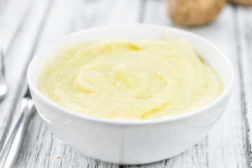 Mashed Potatoes (selective focus) on vintage wooden background