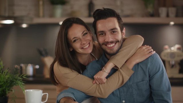 Portrait of a Handsome Smiling Couple in the Kitchen. Shot on RED Cinema Camera in 4K (UHD).