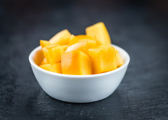Kaki fruits on a slate slab (selective focus)