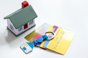 credit cards concept mortgag for new home on white background