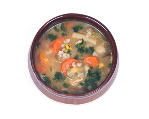 Chicken, barley and vegetable soup in ceramic bowl isolated on white background