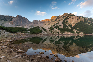 Amazing Sunrise with Colored in red rock of Sinanitsa peak and  the lake, Pirin Mountain, Bulgaria