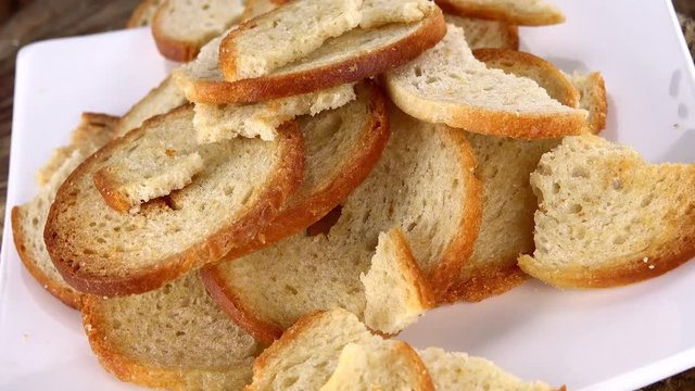Portion of rotating Bread Chips as not loopable 4K UHD footage