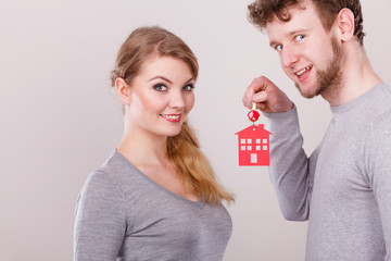Couple with house keys.