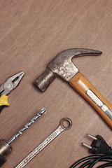 Many old tools on wood background