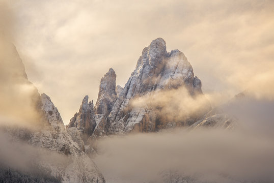Cima Dodici mountain covered with clouds at sunrise, Bolzano, Italy 