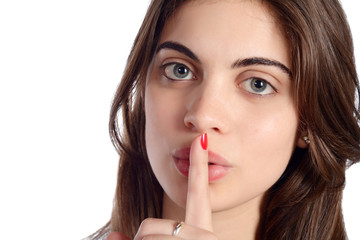 Fototapeta premium Close up of young woman making silence gesture.