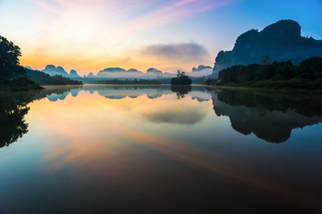 Beautiful sunrise and reflections at Nongtalay lagoon