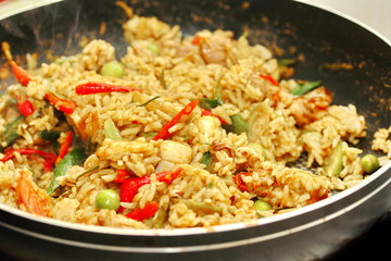 Cooking ,Fried jasmine rice in green curry with mixed meat.
