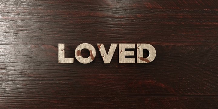 Loved - grungy wooden headline on Maple  - 3D rendered royalty free stock image. This image can be used for an online website banner ad or a print postcard.
