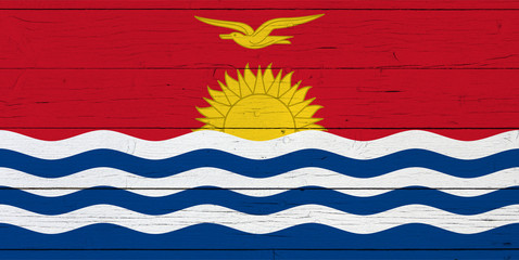 Flag of Kiribati on wooden background