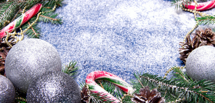 Christmas Composition with Snow Silver Balls Candy Cane Pine Con