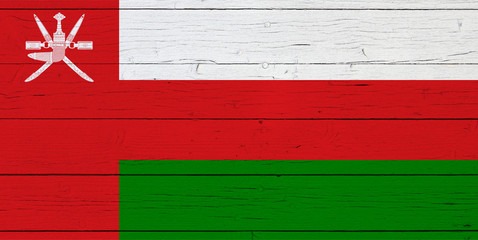 Flag of Oman on wooden background