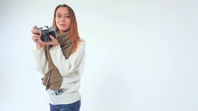 young woman model with retro film camera 