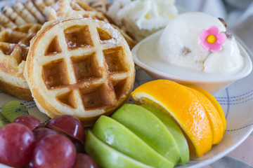 French toast with ice cream and fruit.