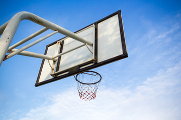 Basketball hoop and blue sky and cloud background