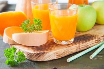 pumpkin apple juice in a glass, selective focus