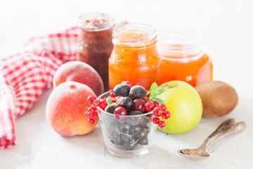 berries, fruit and jam on a table, selective focus