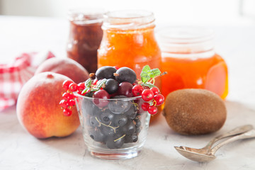 berries, fruit and jam on a table, selective focus