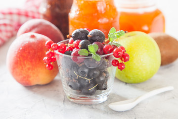 berries, fruit and jam on a table, selective focus