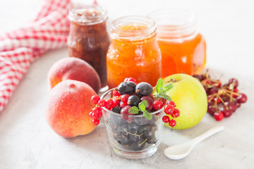Fototapeta na wymiar berries, fruit and jam on a table, selective focus