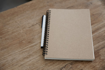 Blank notepad on wooden table.