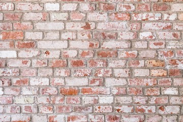 Texture of old rustic brick wall painted with white