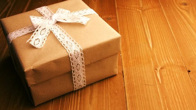 Close-up of wrapped gift box on wooden table